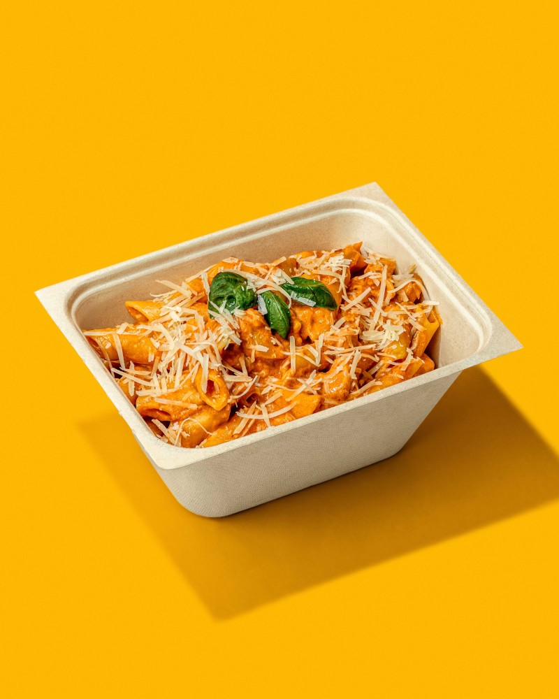 Pasta topped with cheese and herbs