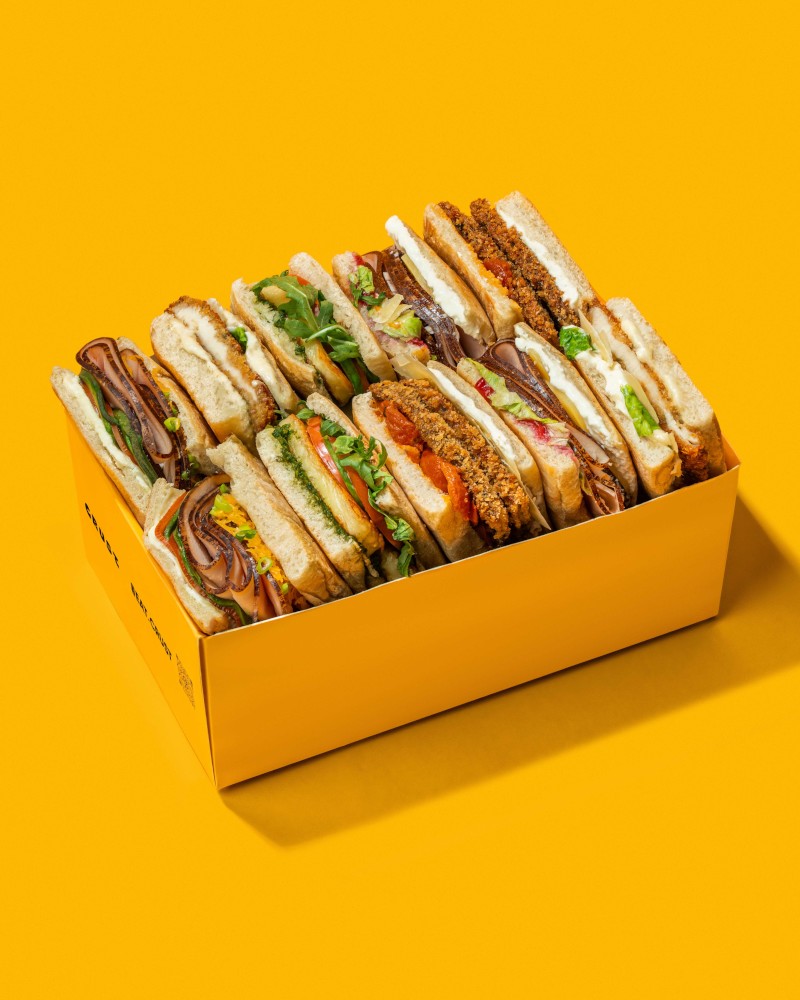 A full tray of Eat Crust sandwiches