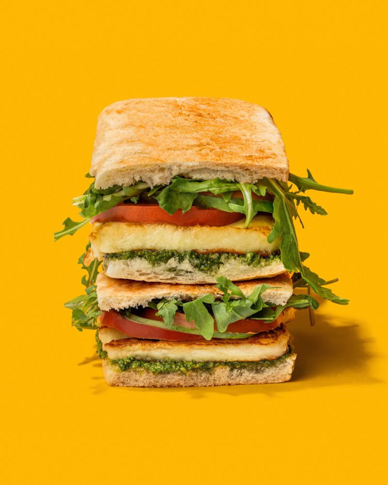 Stacked sandwich with greens and cheese